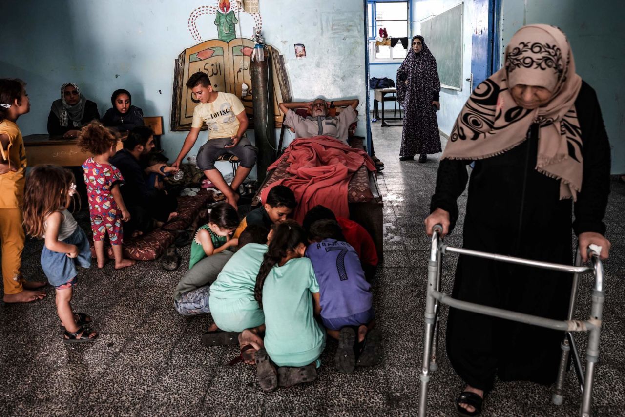 Palestinians fleeing Israeli airstrikes take refuge in a school run by the United Nations in Gaza City on Sunday.