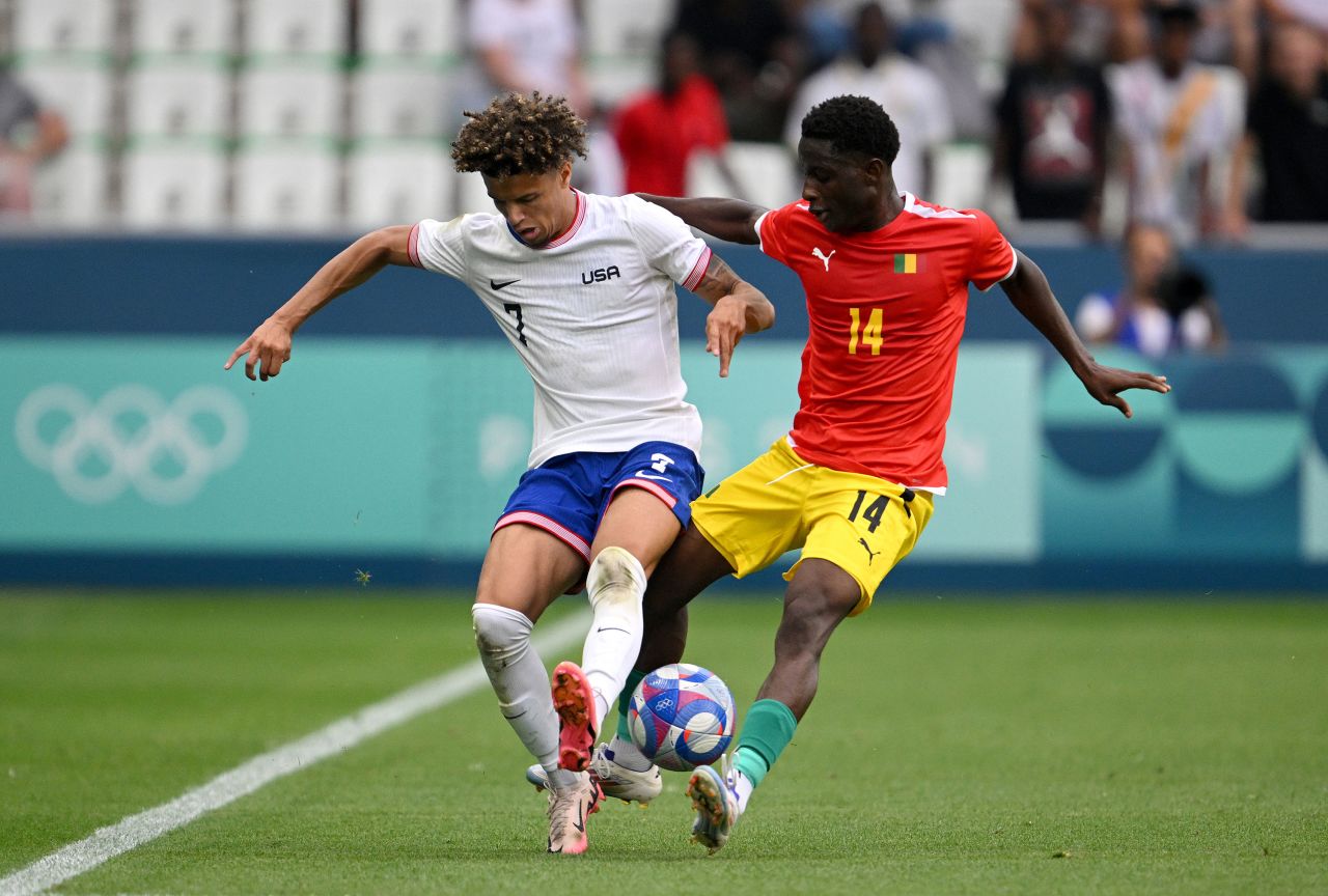 Kevin Paredes of the United States, left, and Amadou Diallo of Guinea battle for the ball on Tuesday.