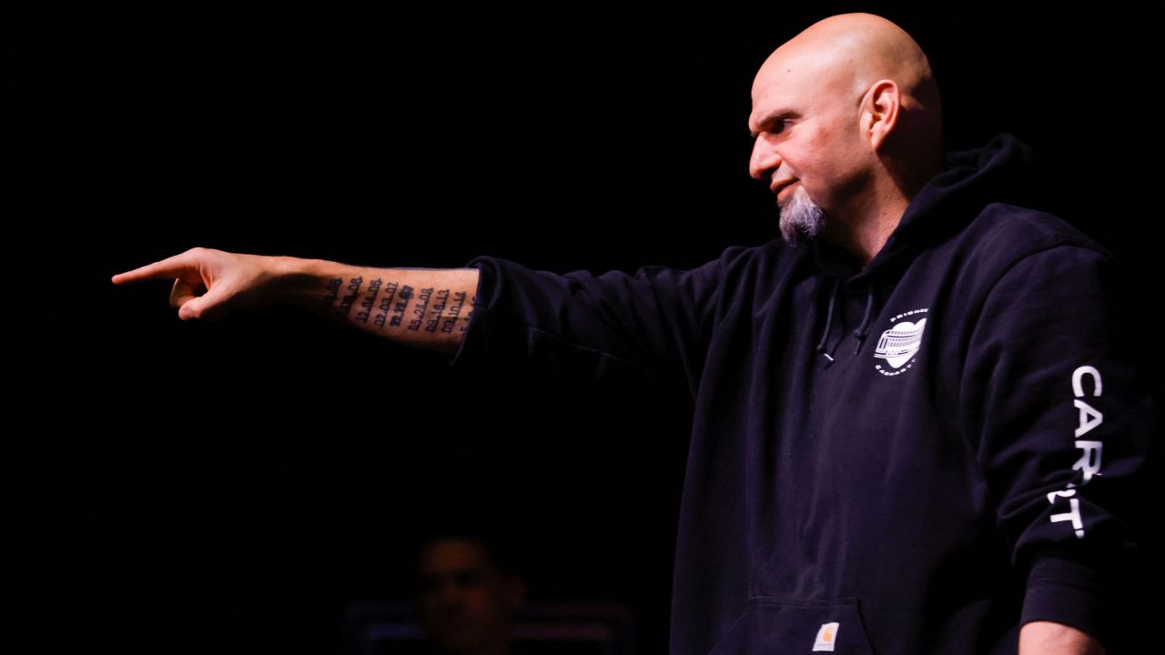 Fetterman points to people in the crowd.