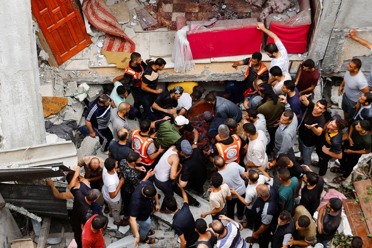 Rescuers remove a person on a stretcher from under the rubble of a house destroyed during Israeli strikes in Rafah, southern Gaza, on Monday.