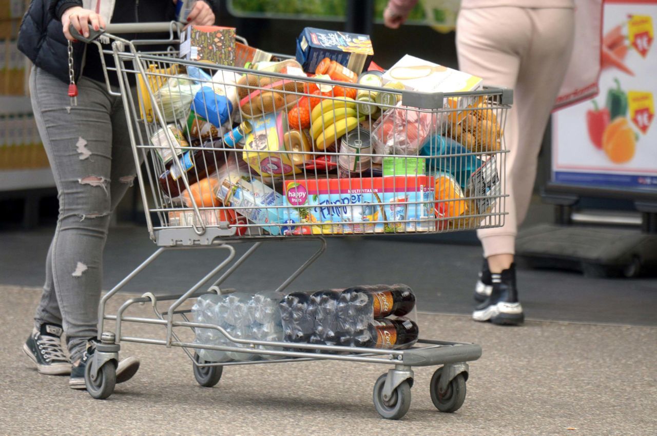 A person pushes a shopping cart with groceries in Stockerau, Austria on March 13.