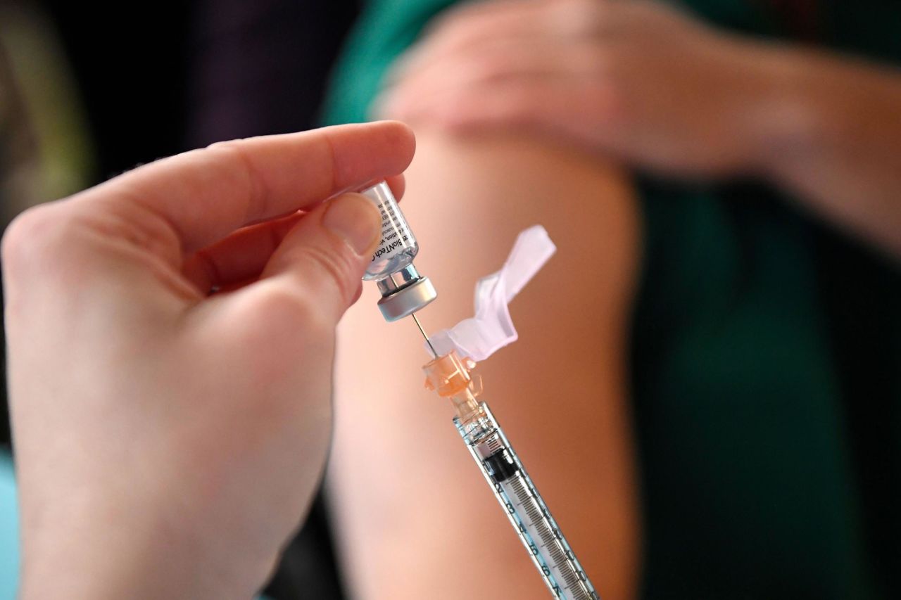 A medical worker prepares to administer the Pfizer-BioNTech Covid-19 vaccine to a frontline worker at Hartford Hospital on Dec. 14 in Hartford, Connecticut.