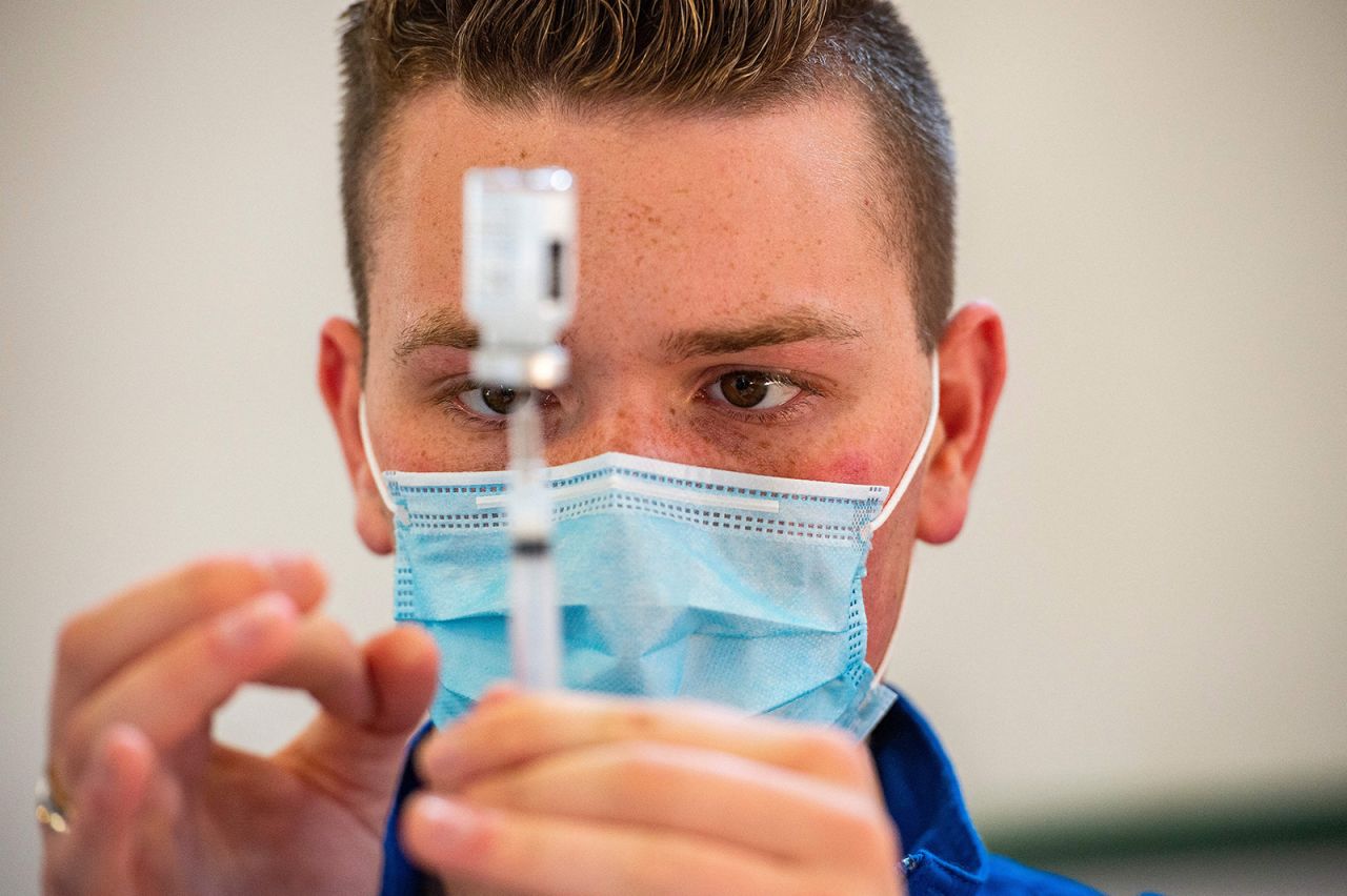 Registered nurse Frederick Morley loads syringes with the Moderna Covid-19 vaccine at a vaccination clinic in Bridgeport, Connecticut, on April 20