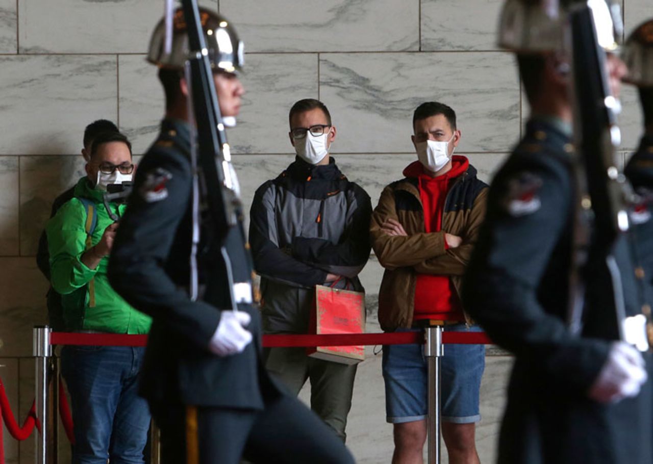 People wear face masks to protect against the spread of the new coronavirus at Chiang Kai-shek Memorial Hall in Taipei, Taiwan, Thursday, February 27. 