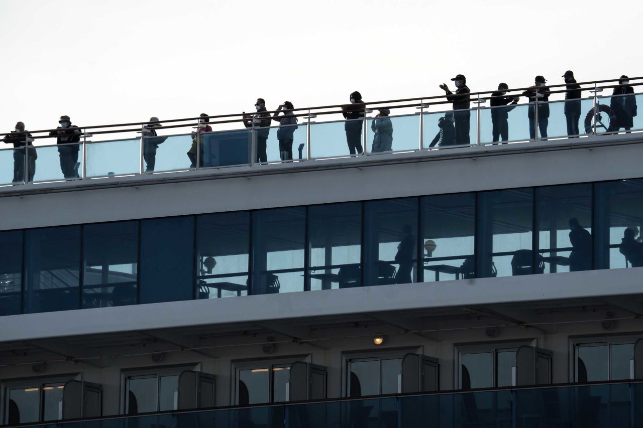 Passengers are seen on board the Diamond Princess cruise ship in Yokohama, Japan, on February 12.