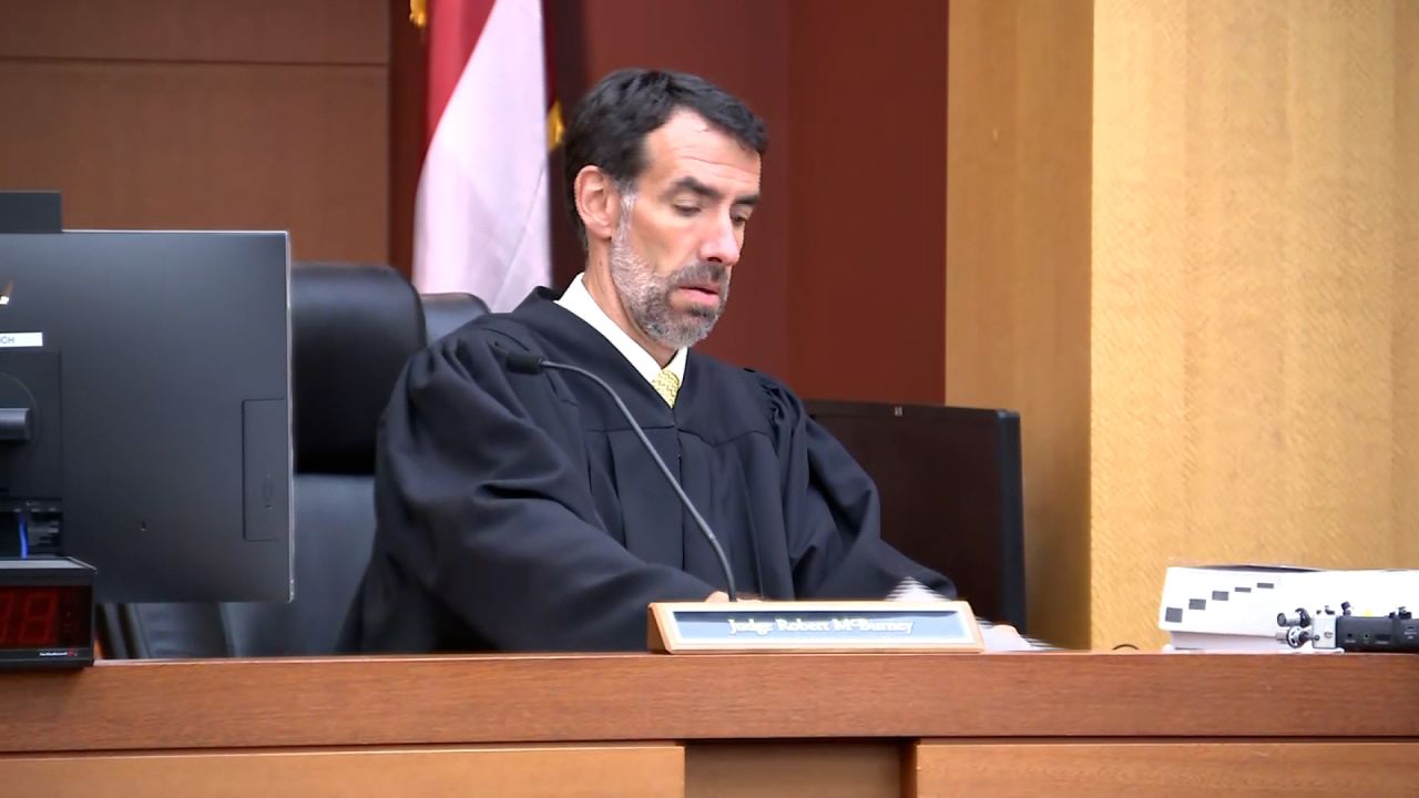 Fulton County Superior Court Judge Robert McBurney reviews the grand jury’s finding on Aug. 14.