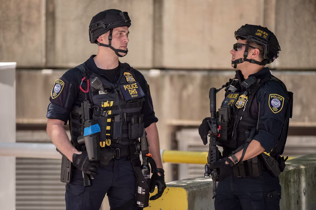 Law enforcement officers stand outside the courthouse on June 13, 2023.