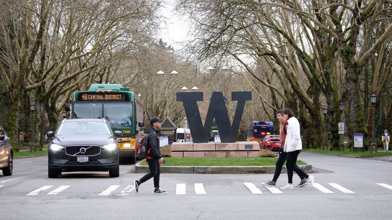 Students walk around the University of Washington campus for the last day of in-person classes on March 6 in Seattle. The university closed on Monday as a precaution against coronavirus.