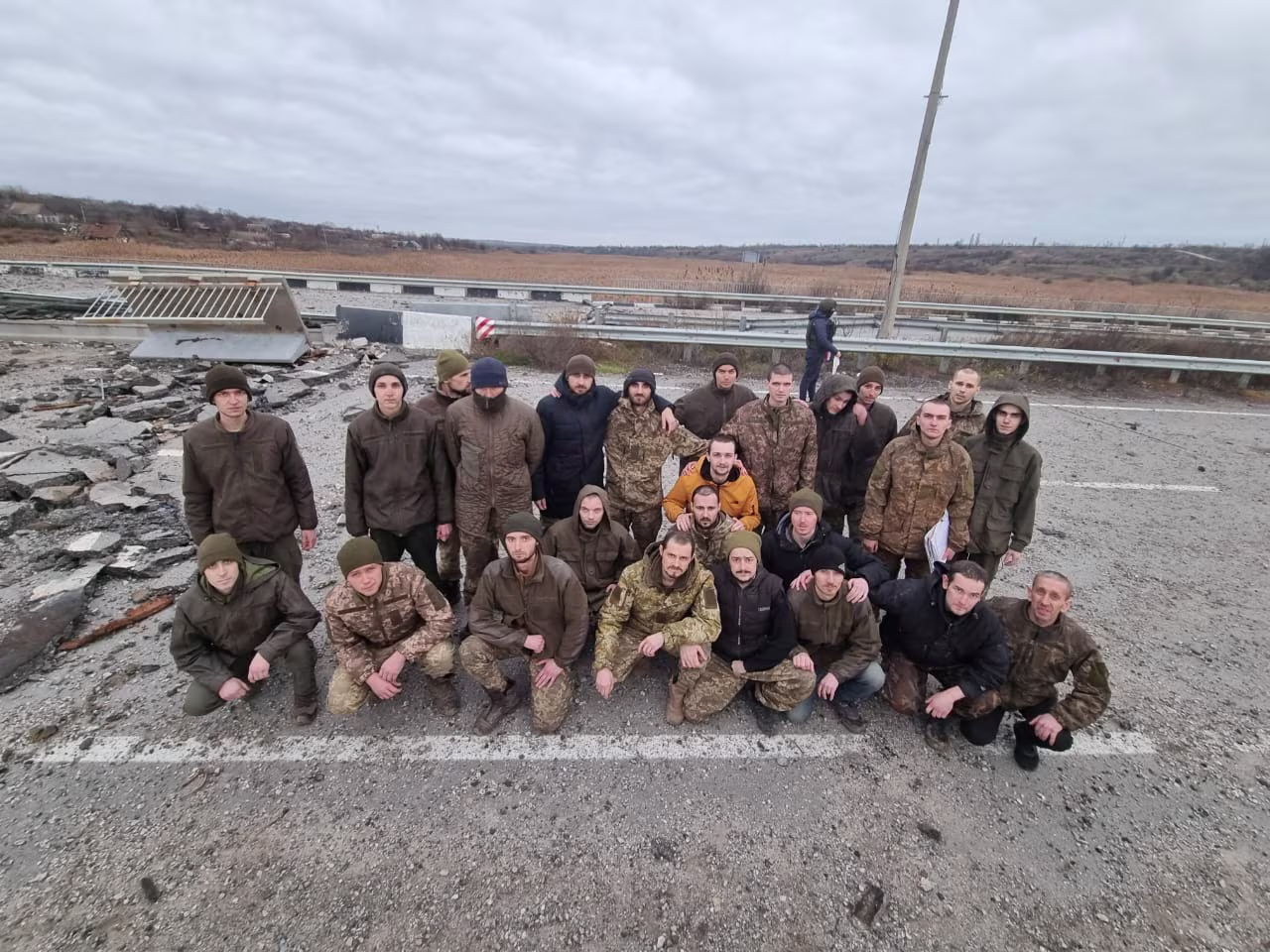 Released Ukrainian prisoners of war pose after a swap in the Zaporizhzhia region, Ukraine, on November 24.