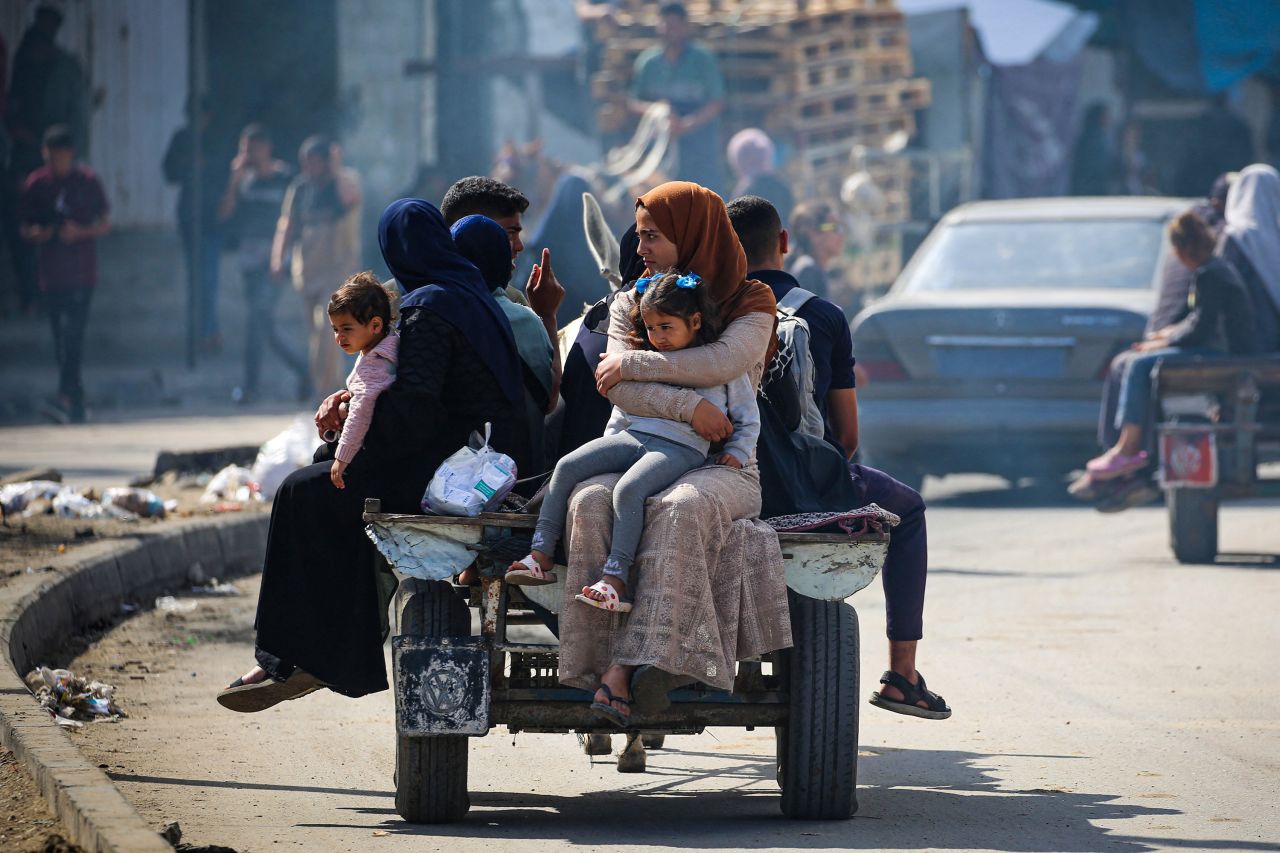 Displaced Palestinians travel on a cart in Rafah, on May 7. 