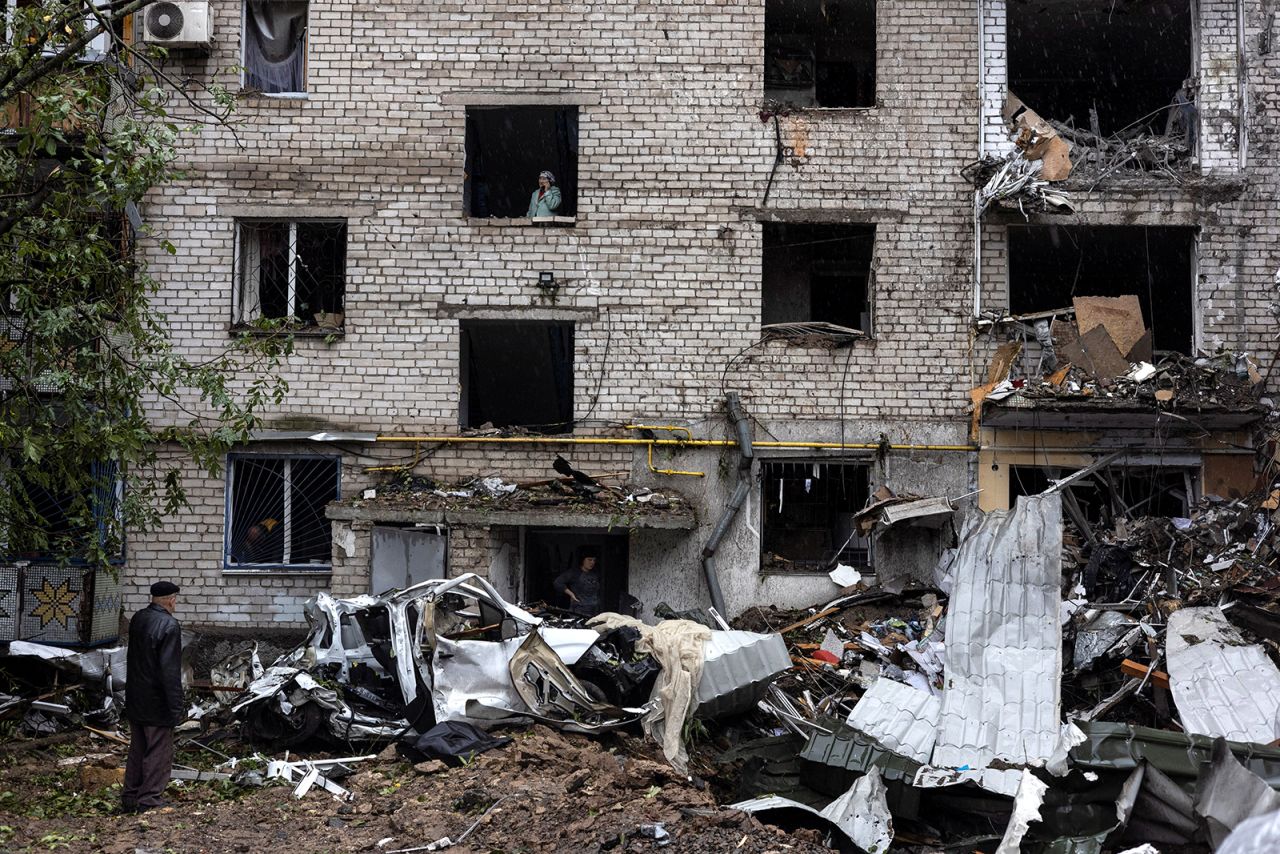 People inspect the damage at a residential building destroyed by a strike in?Mykolaiv on September 11.