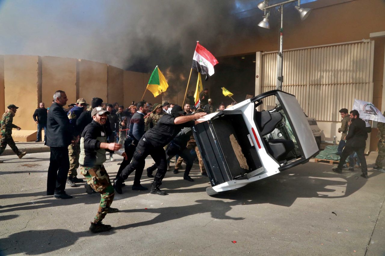Protesters damage property inside the US Embassy compound in the Iraqi capital, Baghdad. Photo: Khalid Mohammed/AP