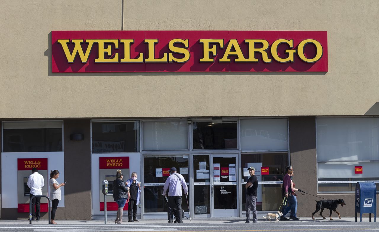 Customers line up outside a Wells Fargo branch in a neighborhood of Los Angeles in April 2020.