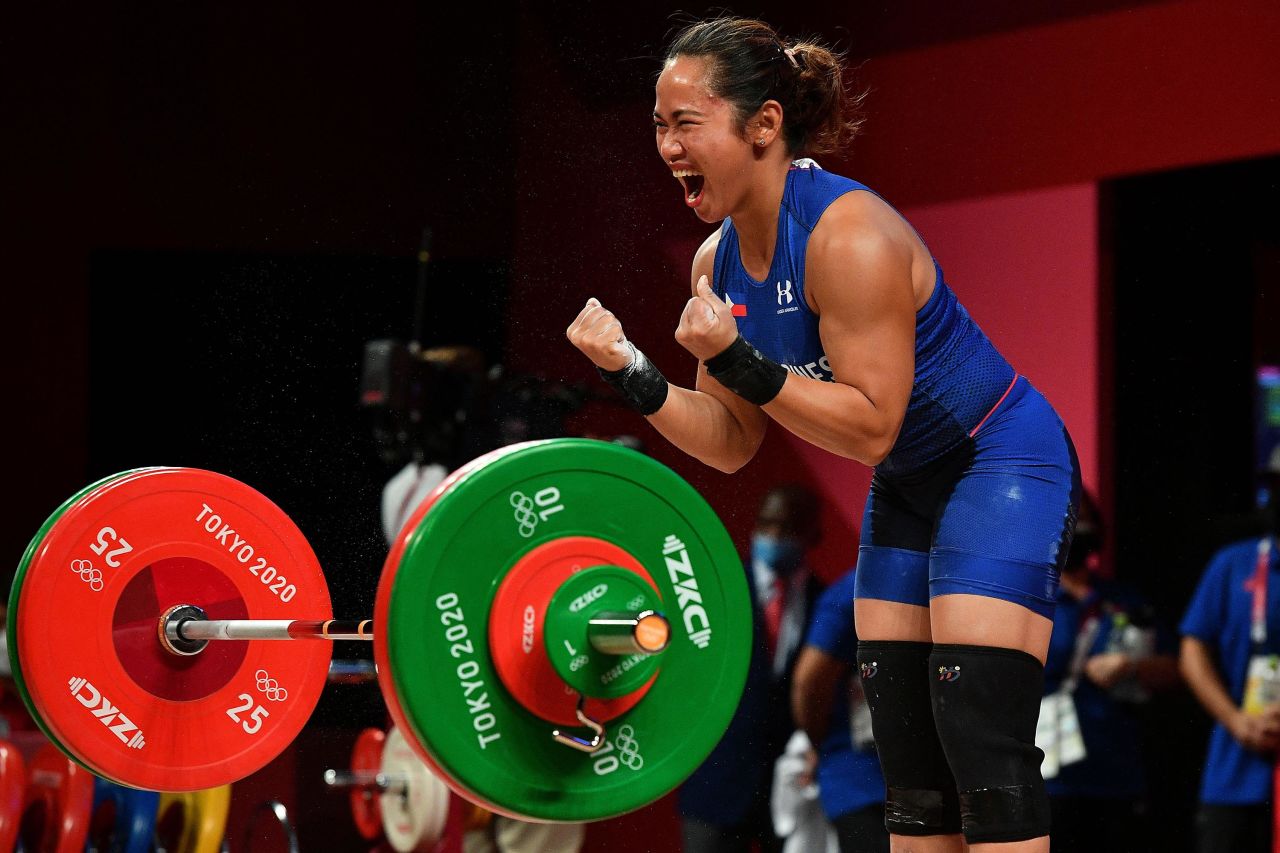 The Philippines' Hidilyn Diaz reacts after winning Olympic gold in the 55-kilogram weightlifting competition on Monday, July 26.