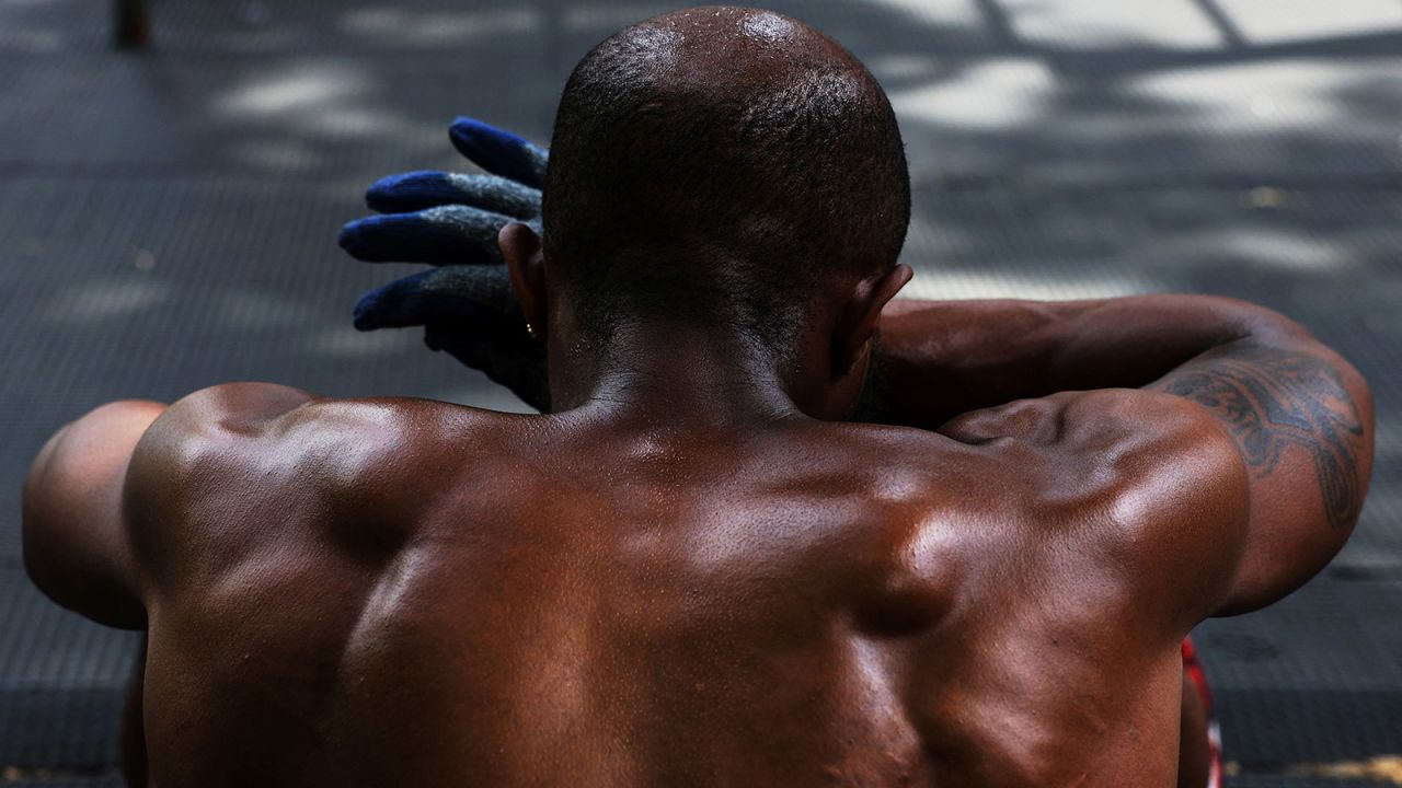 Eddie Hogan wipes sweat from his head, while he works out outdoors during a heat wave in New York City on June 20. 