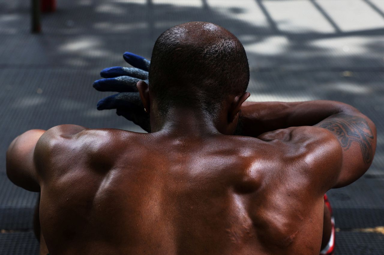 Eddie Hogan wipes sweat from his head, while he works out outdoors during a heat wave in New York City on June 20. 