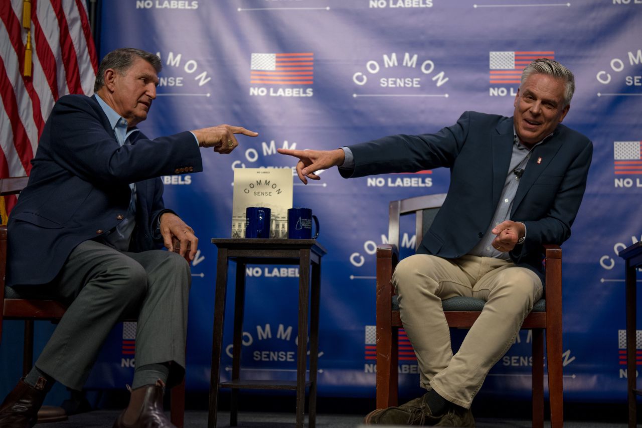 Sen. Joe Manchin, left, and former Gov. of Utah Jon Huntsman speak at an event sponsored by No Labels in July in Manchester, New Hampshire.