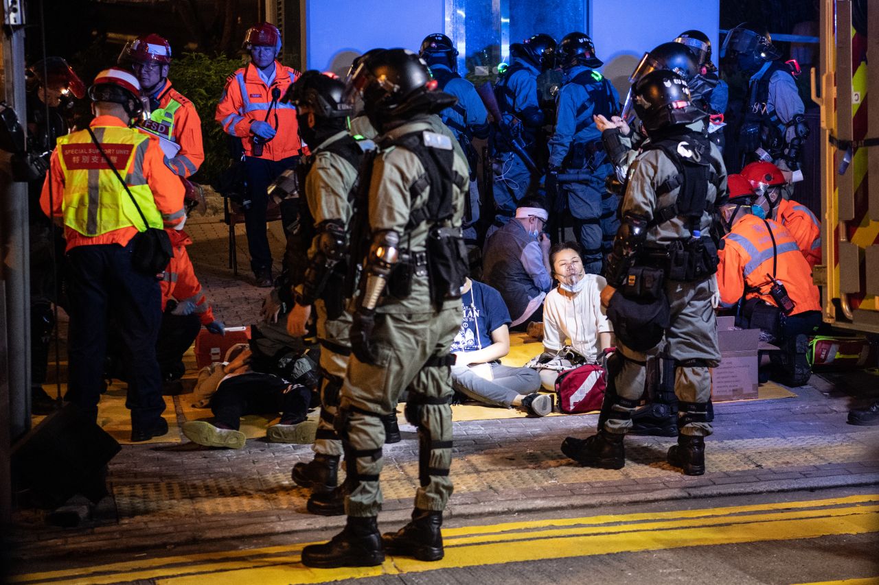 Injured people are taken away after clashes between anti-government protesters and police at Hong Kong Polytechnic University on November 18, 2019.
