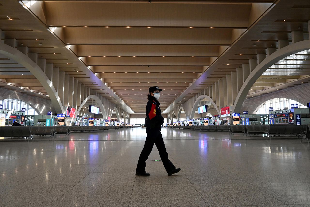 A police patrol is seen walking in an empty railway station in Shijiazhaung, China, on January 7.