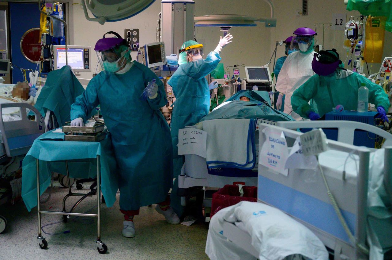 Healthcare workers attend to a coronavirus patient at the Intensive Care Unit of the La Paz University Hospital in Madrid, Spain, on April 23.