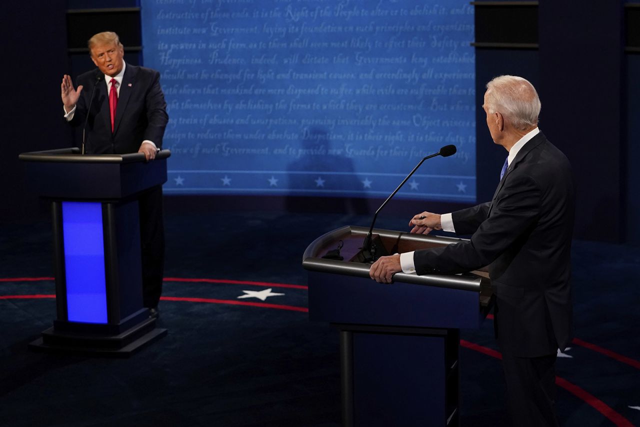 President Donald Trump answers a question as Democratic presidential candidate Joe Biden listens during the second and final presidential debate on Thursday in Nashville. 