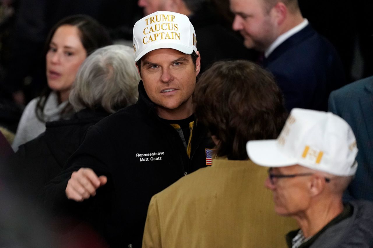 Rep. Matt Gaetz arrives at a caucus night party in Des Moines on Monday.