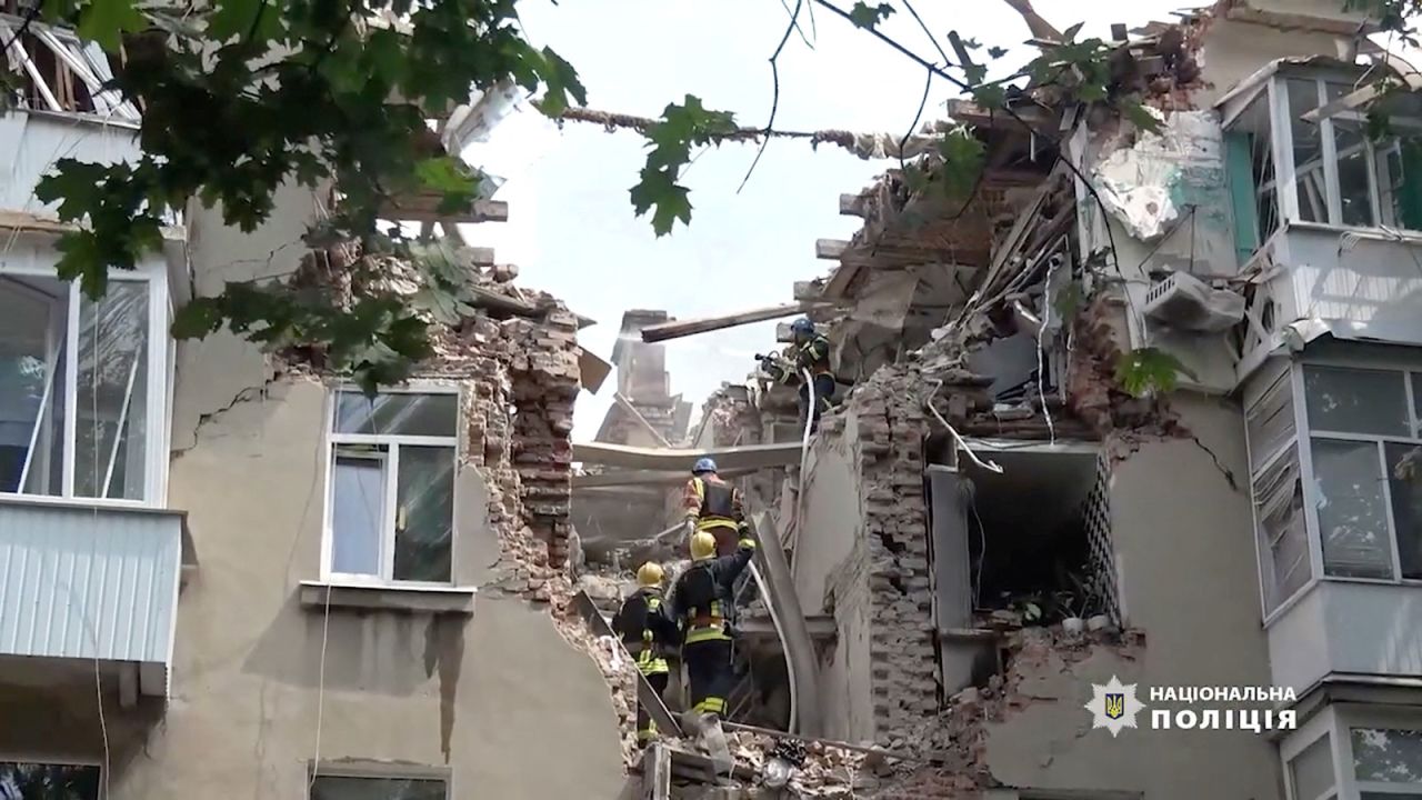 Rescue workers at a damaged building after a drone strike in Sumy, Ukraine, on July 3. 