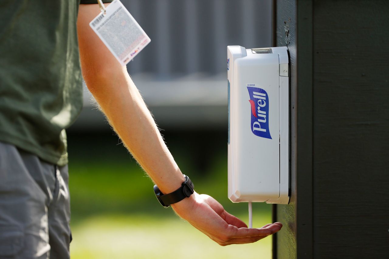 A person uses Purell hand sanitizer during the first round of the Arnold Palmer Invitational in Orlando, Florida, on March 5.