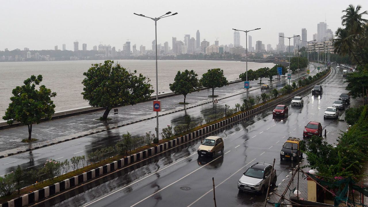 Commuters drive along Marine Drive in Mumbai as Cyclone Nisarga barreled toward India's western coast on Wednesday.