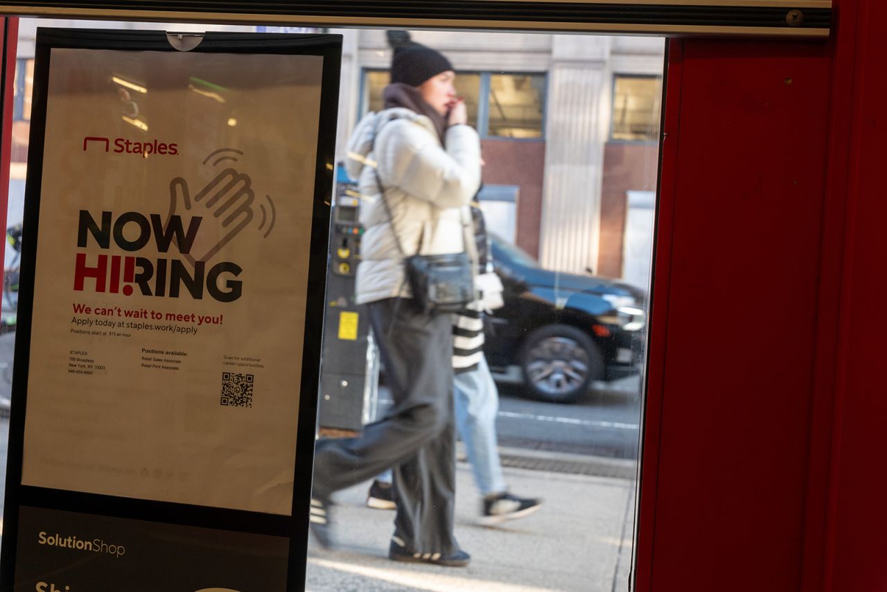 A 'now hiring' sign is displayed in a retail store in Manhattan on January 5 in New York City.?