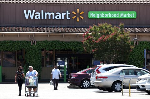 Customers leave a Walmart store on August 4 in Rohnert Park, California.