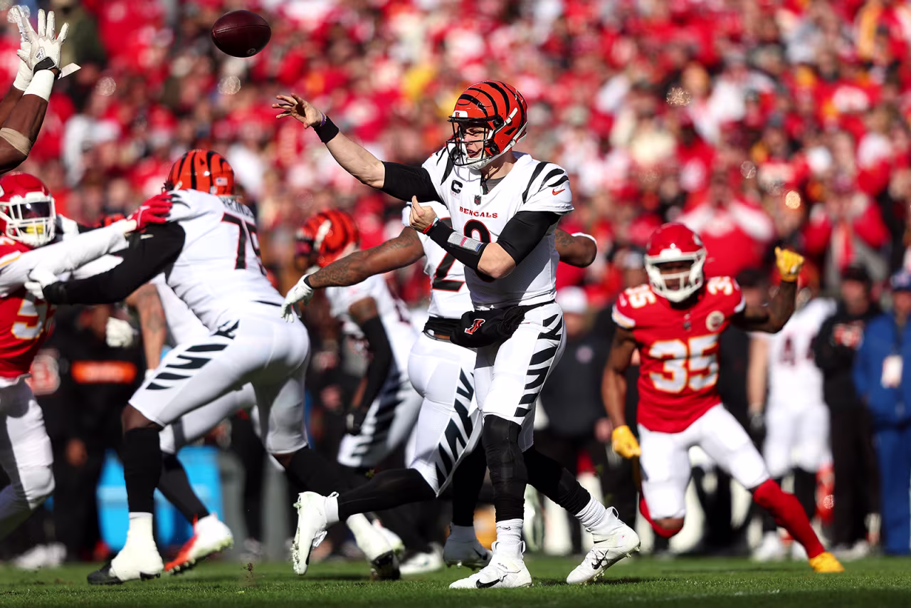 Quarterback Joe Burrow #9 of the Cincinnati Bengals throws a first quarter pass against the Kansas City Chiefs in the AFC Championship Game at Arrowhead Stadium on January 30, in Kansas City, Missouri.