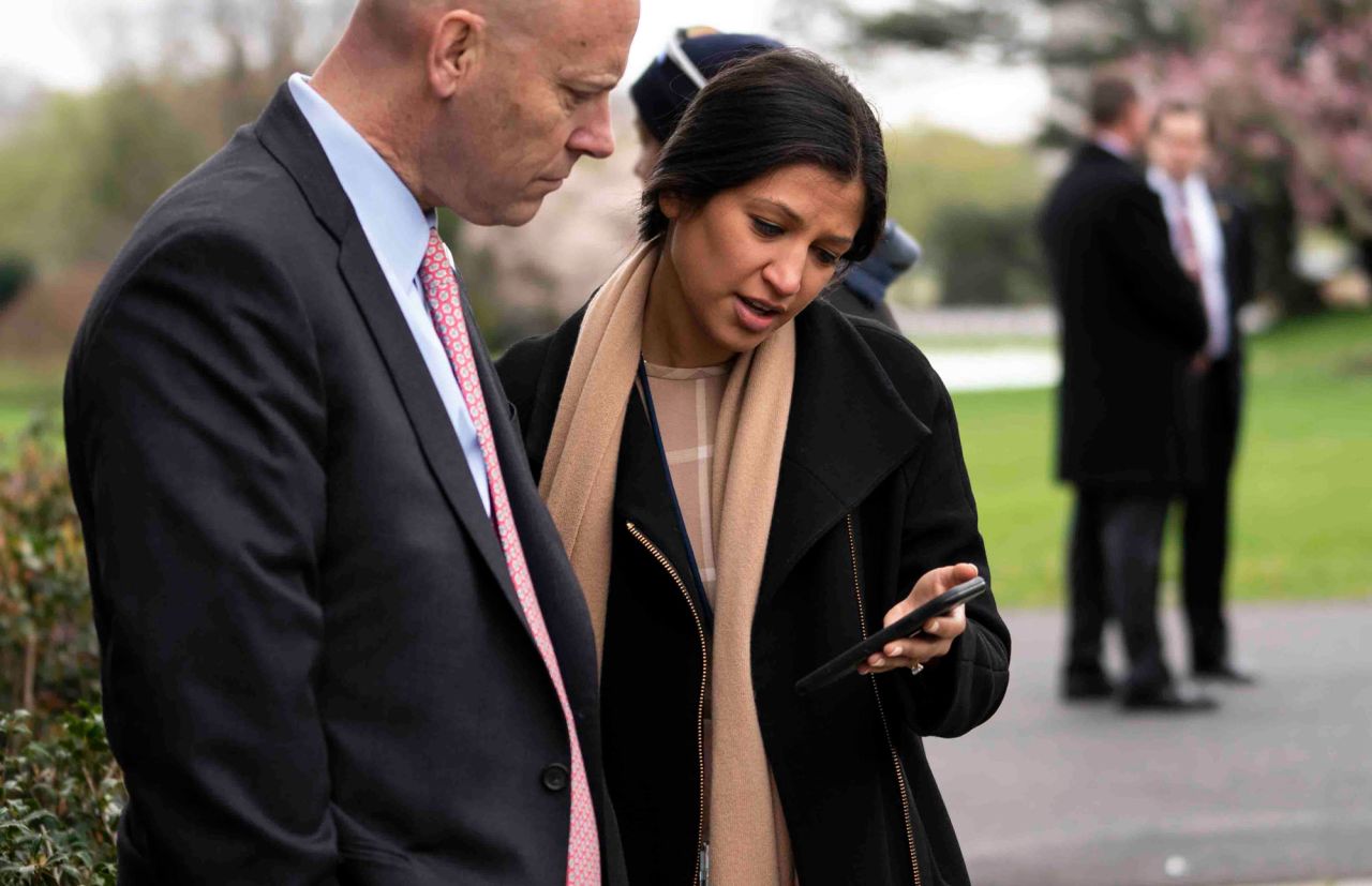 Katie Miller, Vice President Mike Pence's press secretary, speaks with Marc Short, Chief of Staff?for Vice President Mike Pence, in the Rose Garden of the White House on March 24, in Washington.