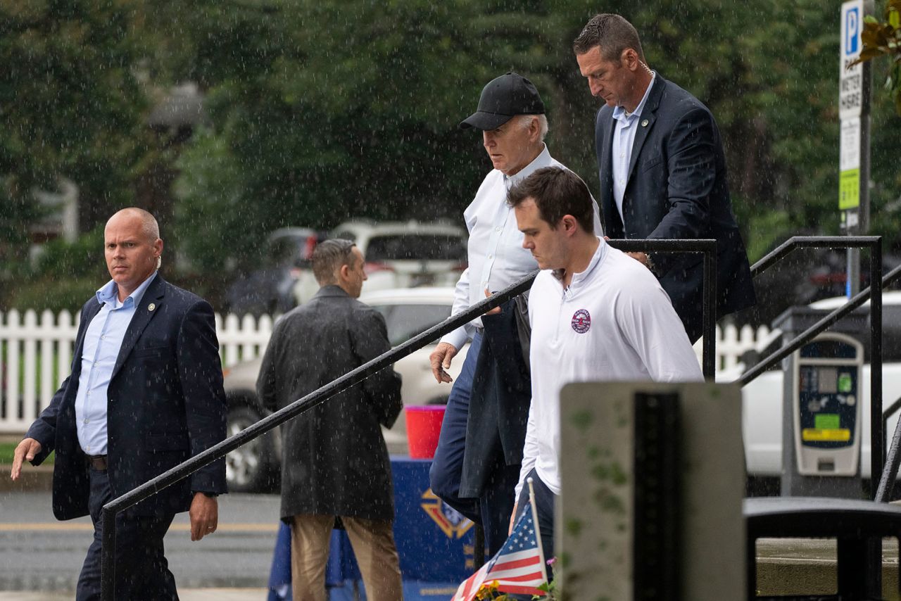 President Joe Biden with Secret Service agents leaves St. Edmond's Roman Catholic Church in Rehoboth Beach, Delaware, after attending mass, on Saturday, July 13. (