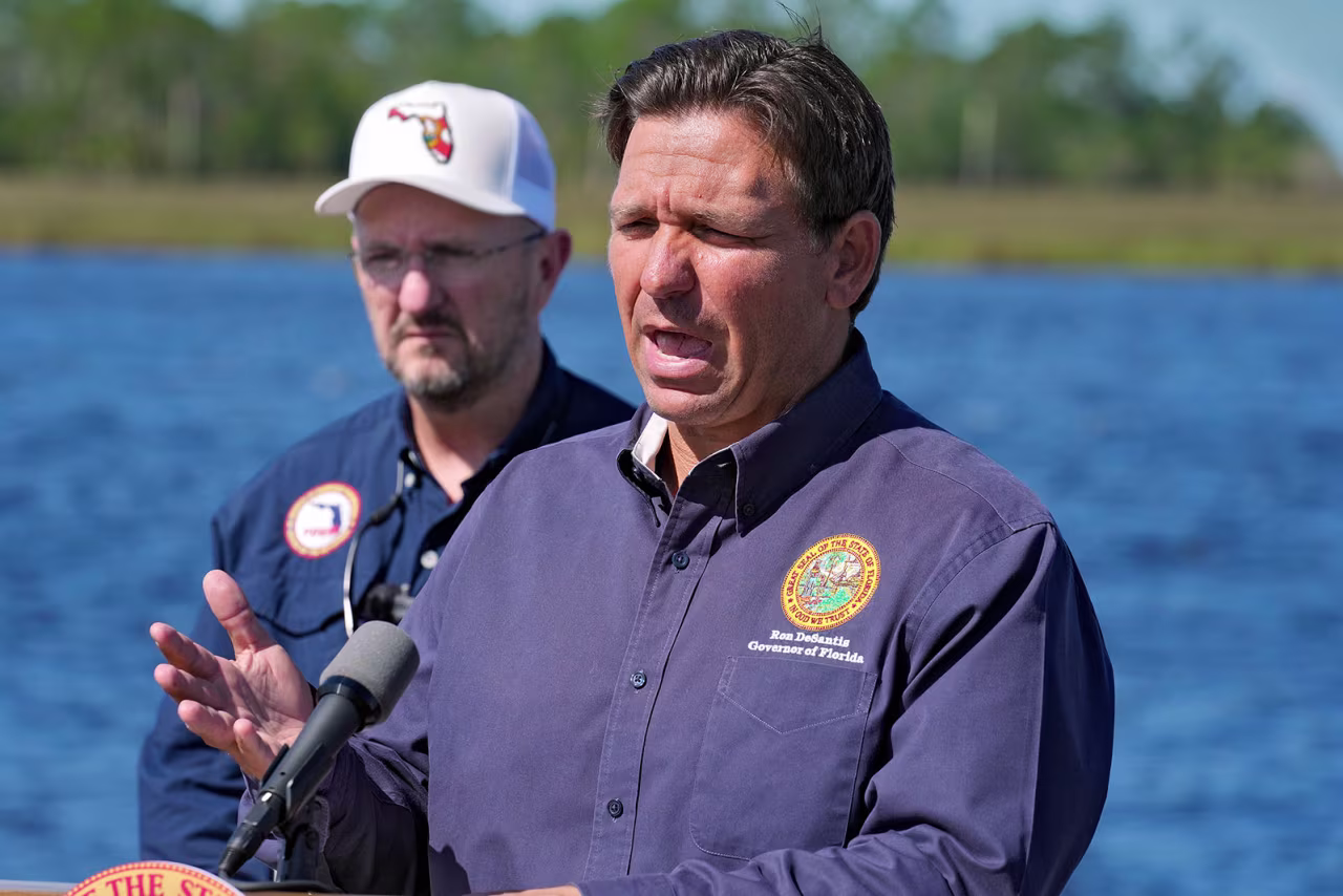 Florida Gov. Ron DeSantis speaks to residents and members of the media on Tuesday in Steinhatchee, Florida. 