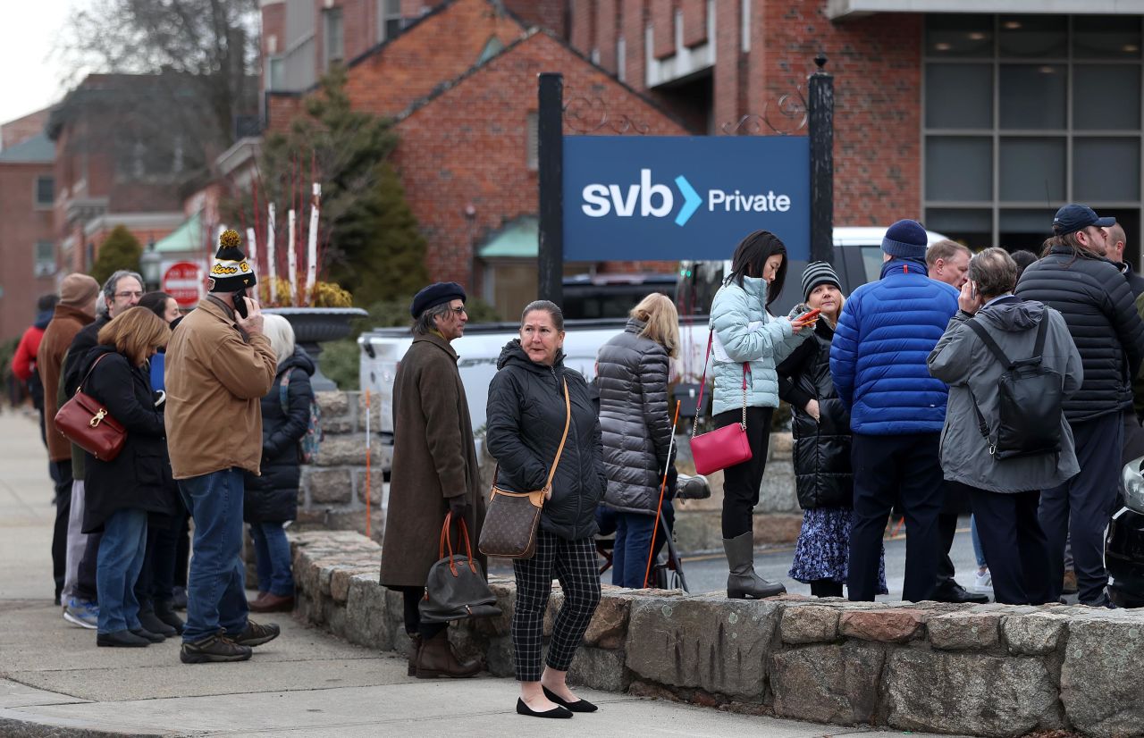 Customers line up outside a Silicon Valley Bank location in Wellesley, Massachusetts, on March 13. 