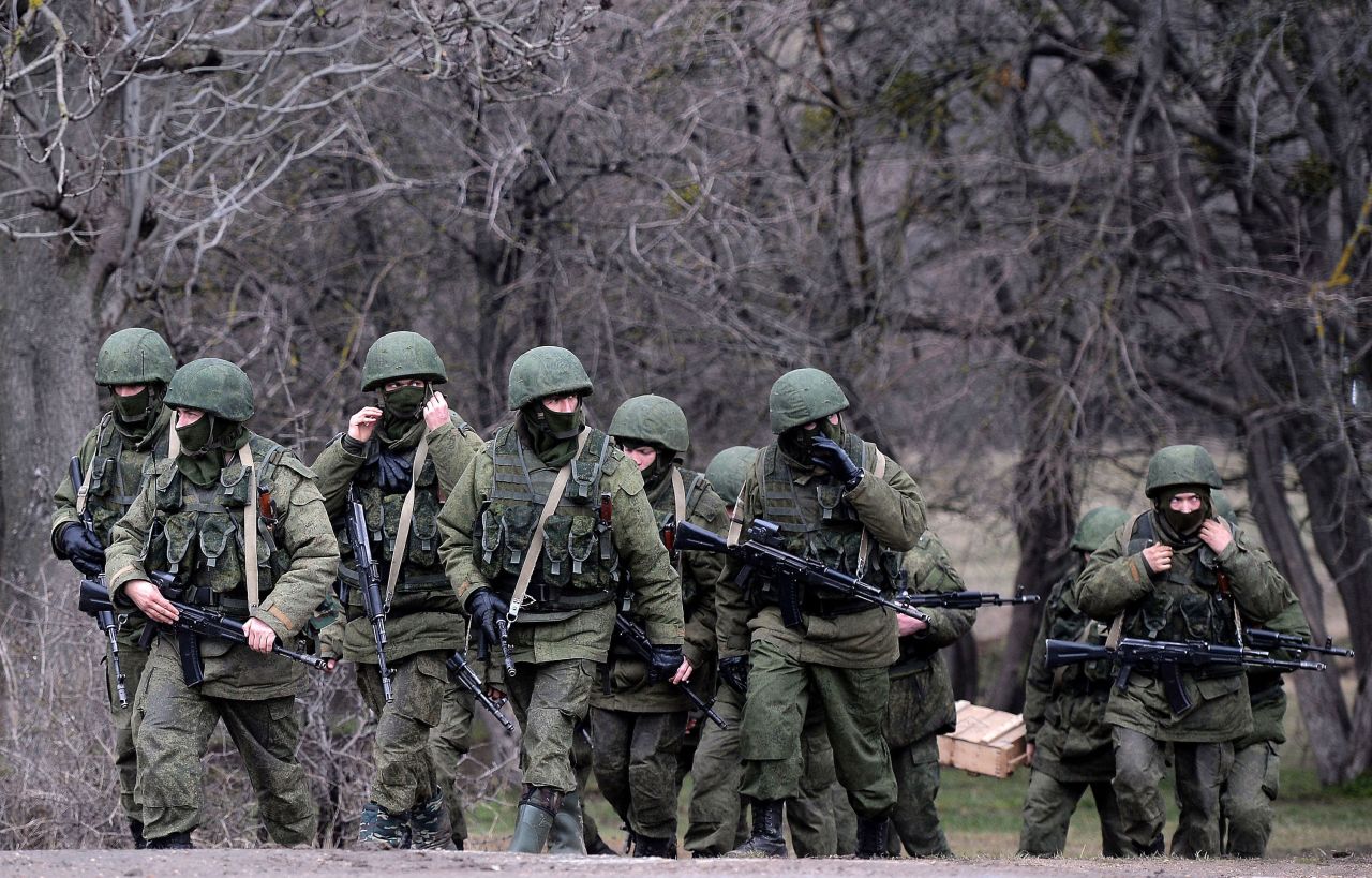 Russian soldiers patrol the area surrounding the Ukrainian military unit in Perevalnoye, outside Simferopol, Crimea, on March 20, 2014. 
