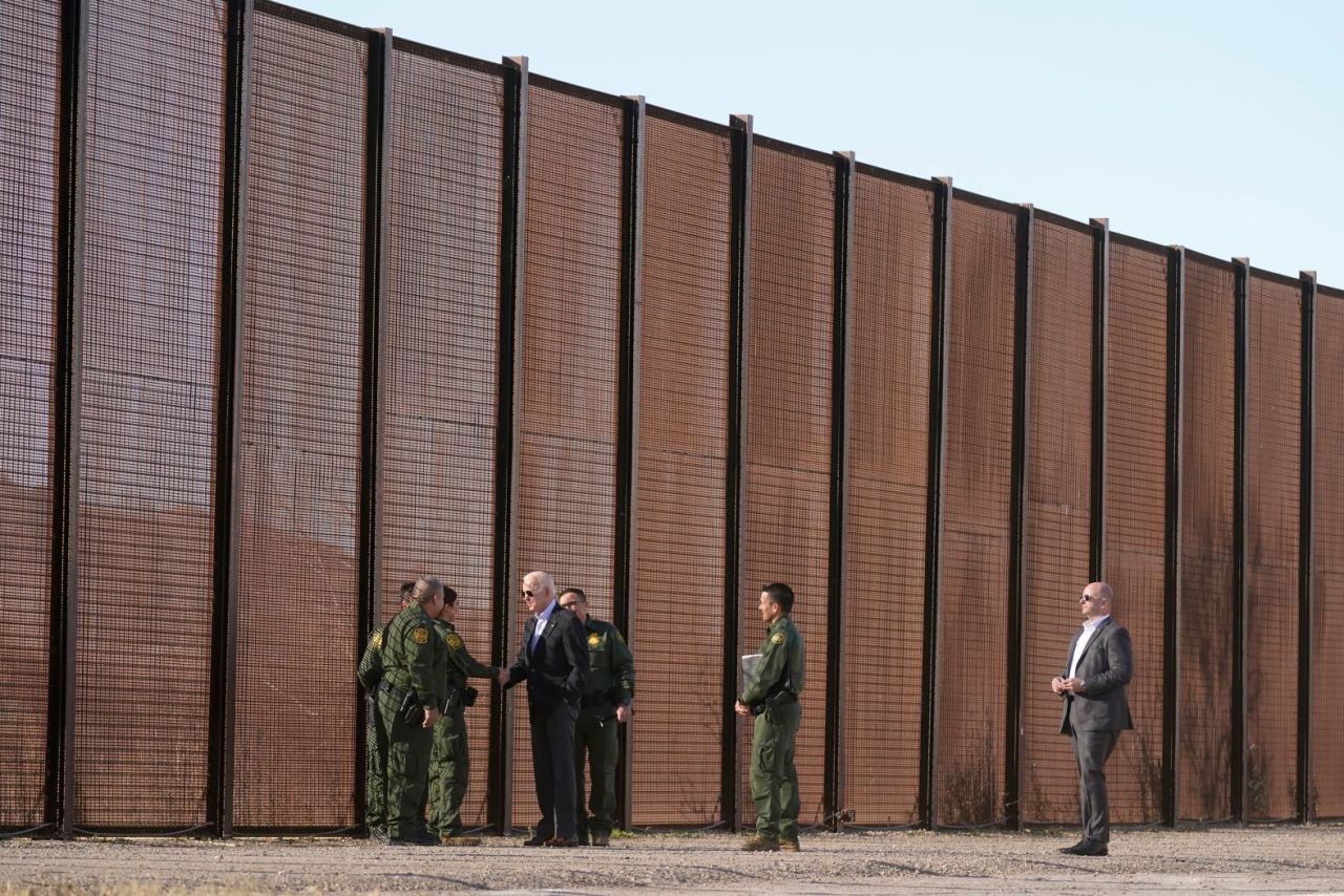 Biden greets Border Patrol agents near the Mexican border in El Paso, Texas, in January 2023. He was making his first visit to the southern border as president.?