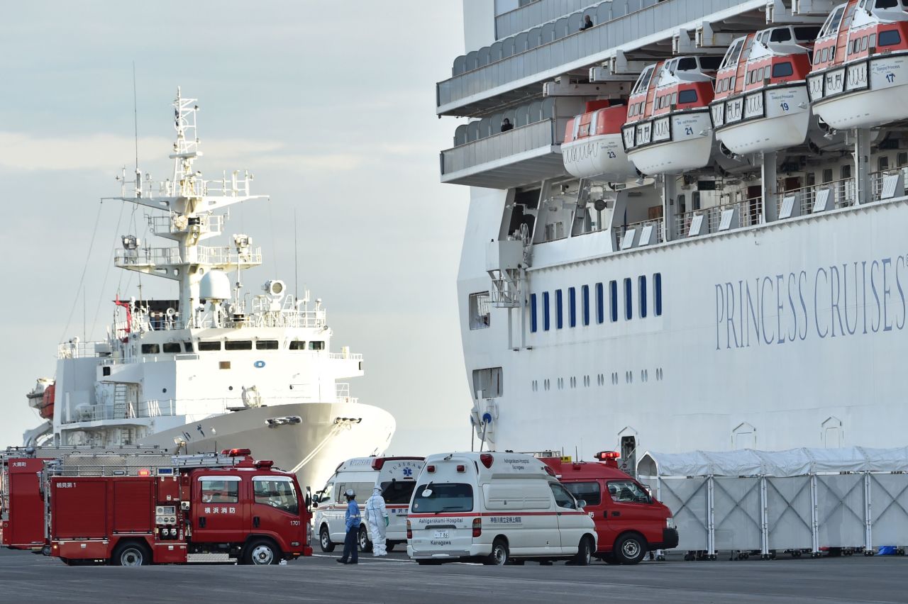 Personnel clad in protective gear on board the Diamond Princess cruise ship prepare to conduct a transfer in Yokohama on February 7, 2020. Photo by KAZUHIRO NOGI/AFP via Getty Images