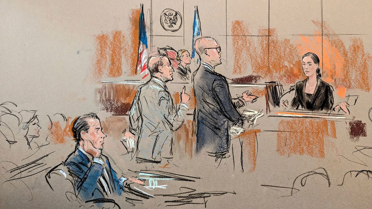 Hunter Biden watches as his daughter Naomi Biden testifies in court on Friday in Wilmington, Delaware.