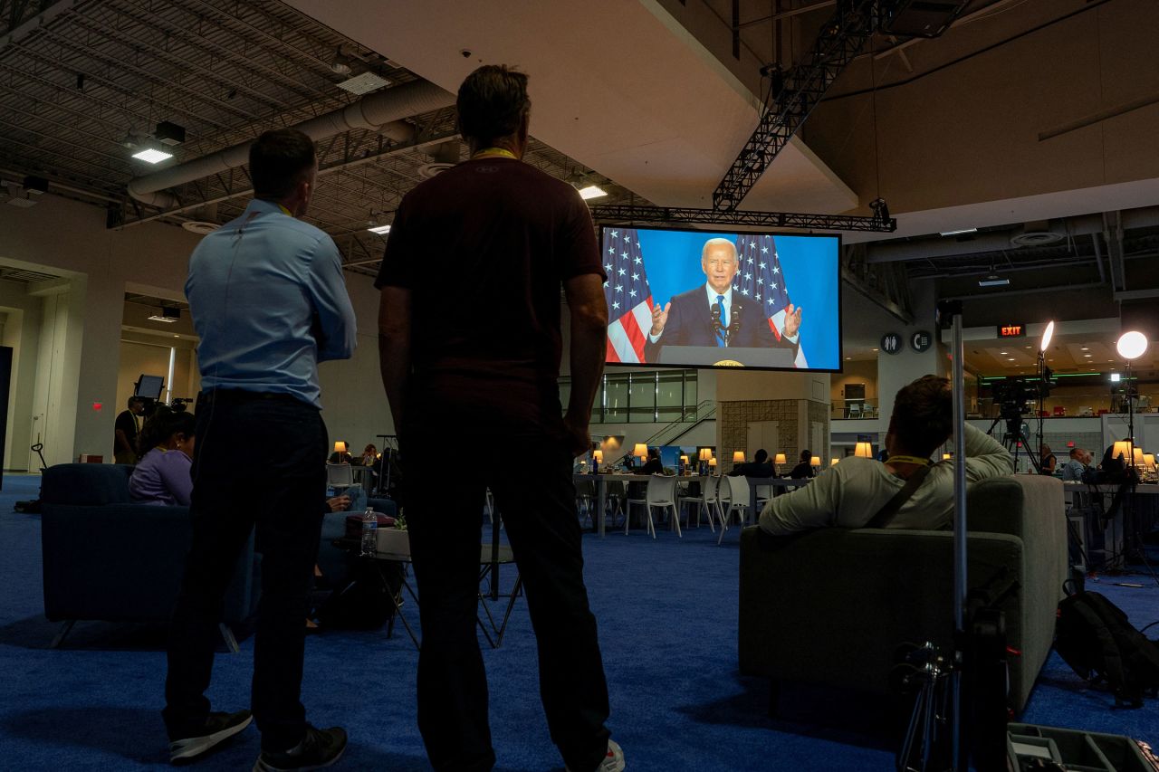 President Joe Biden is seen speaking on a screen in the press media center during NATO's 75th anniversary summit in Washington, DC, on July 11.