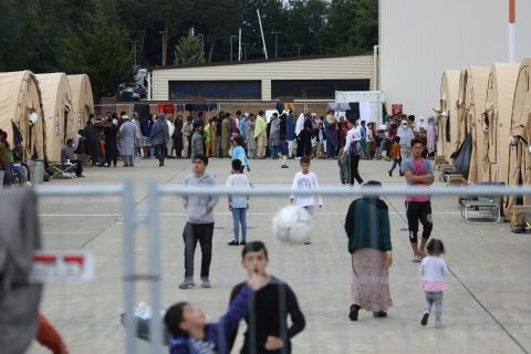 Evacuees walk around a temporary shelter at Ramstein Air Base in Germany on August 26.