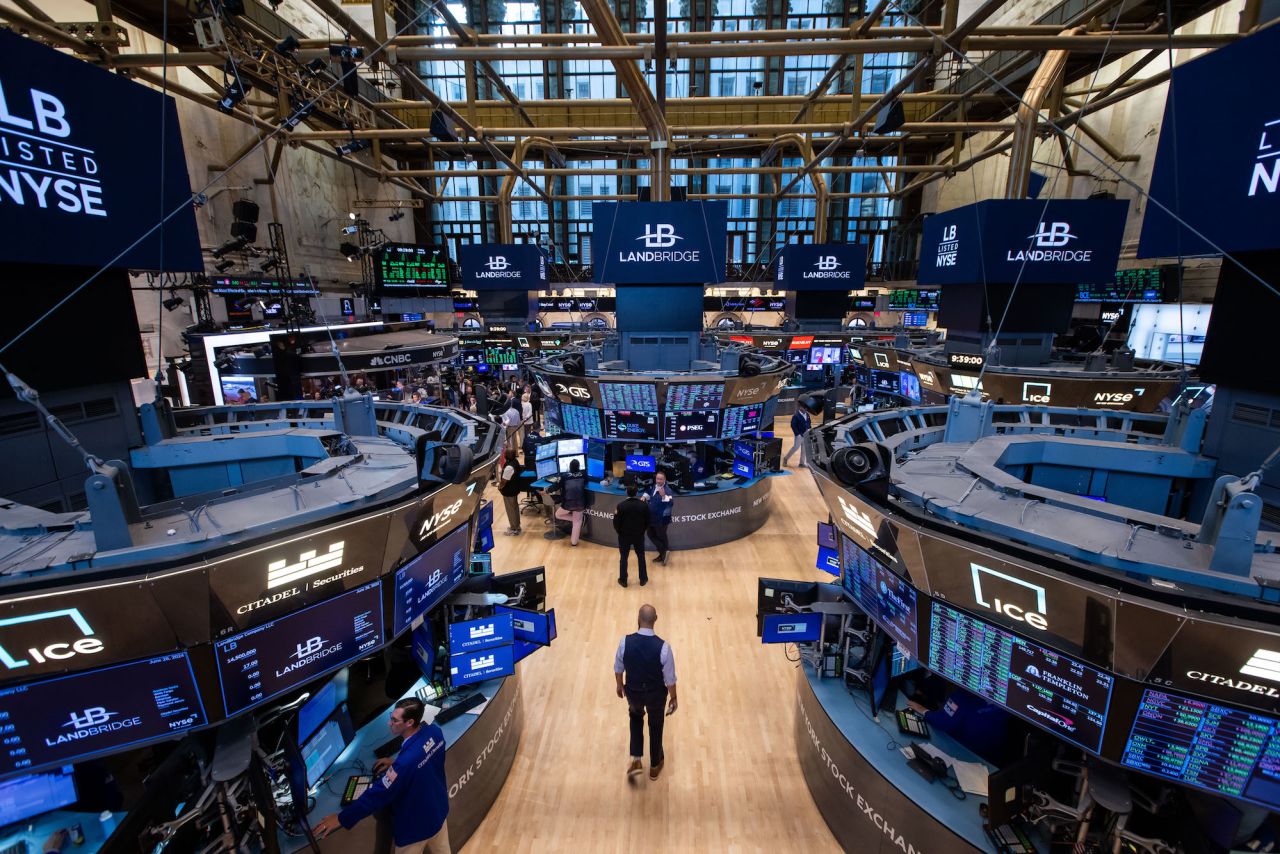 Traders work on the floor of the New York Stock Exchange on June 28.