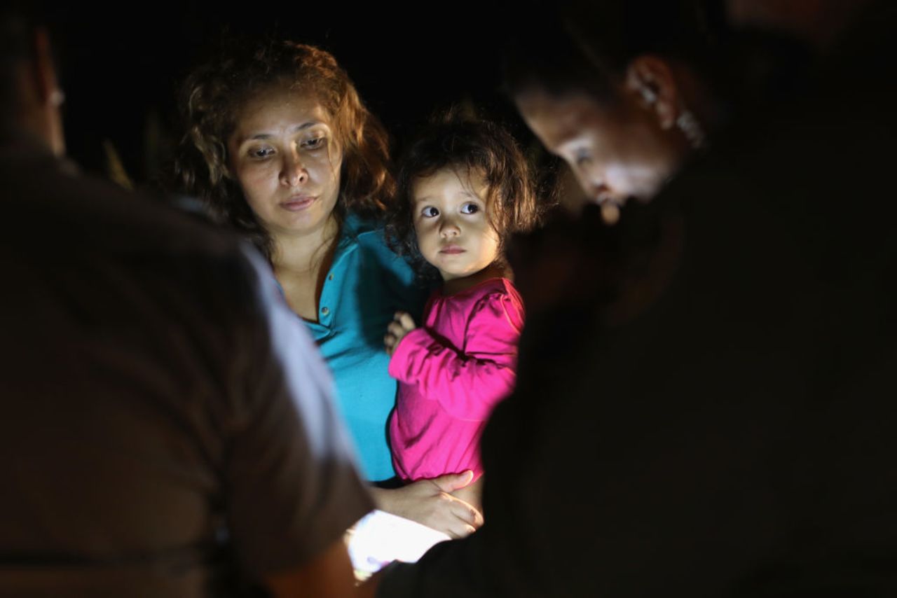 Central American asylum seekers, including a Honduran girl, 2, and her mother, are taken into custody near the US-Mexico border on June 12, 2018 in McAllen, Texas.