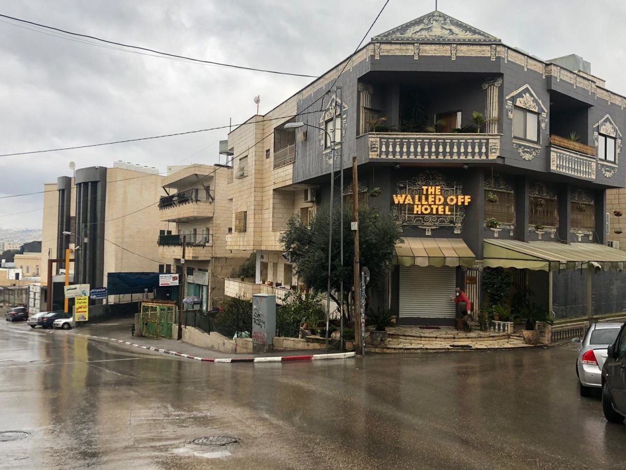 The streets of Bethlehem are deserted and the shutters are down at "The Walled Off Hotel," which lies in the shadow of the wall erected by Israel to separate it from the Palestinian territories.