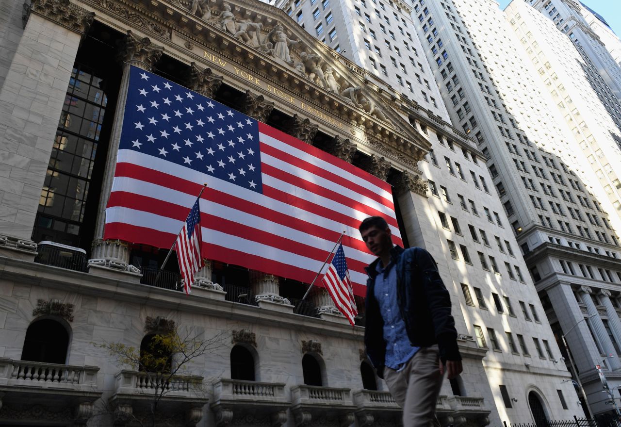 A person walks past the New York Stock Exchange on November 16 in New York City.