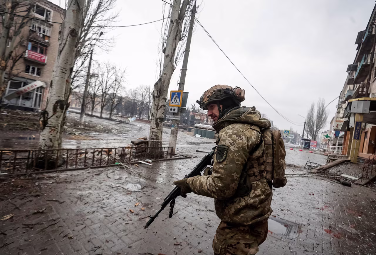 A Ukrainian serviceman walks an empty street in Bakhmut, Ukraine, on February 25. 