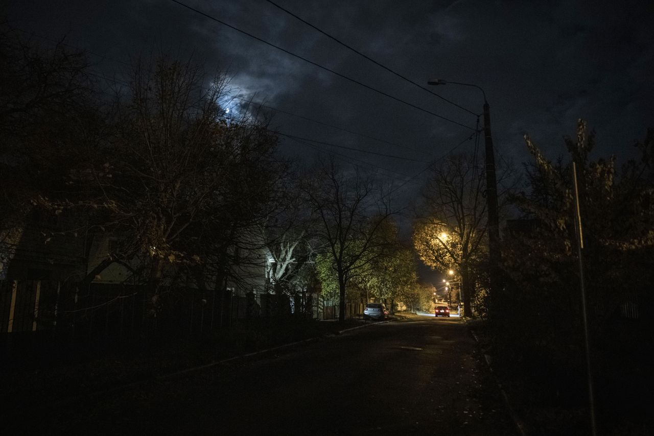A car drives on a dark street on November 2, in Kyiv, Ukraine.