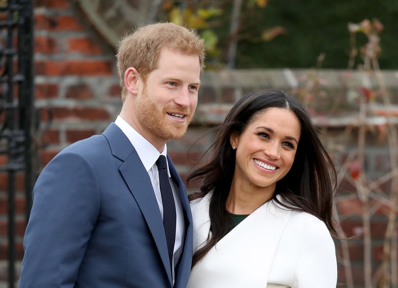 Prince Harry and actress Meghan Markle during an official photocall to announce their engagement at The Sunken Gardens at Kensington Palace on November 27, 2017 in London, England.