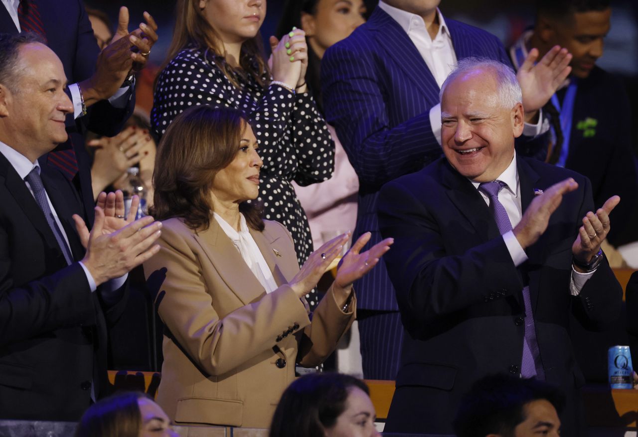 Vice President Kamala Harris, center, and Minnesota Gov. Tim Walz, right, attend the first day of the Democratic National Convention in Chicago, on August 19. 